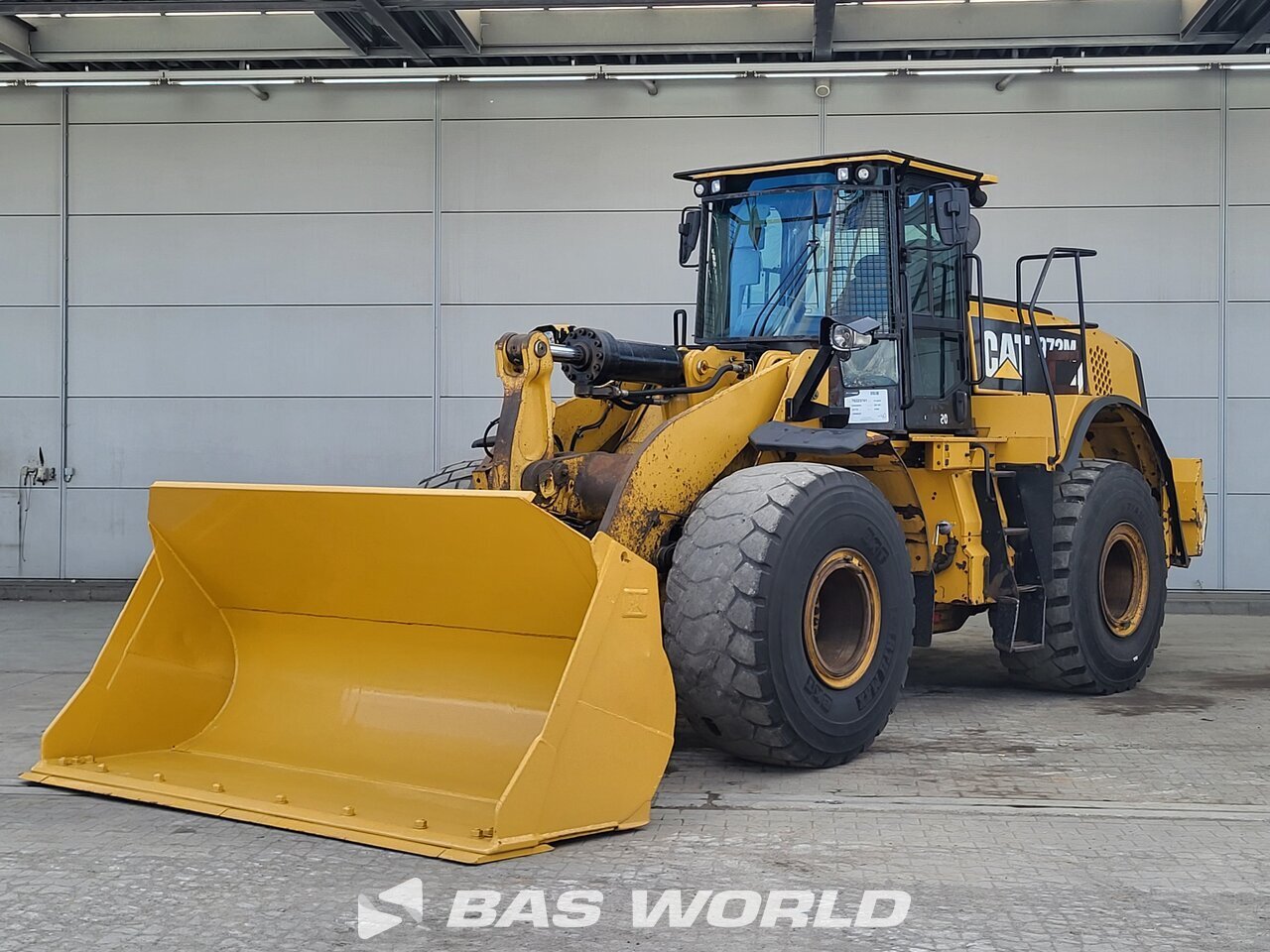 Front left : Caterpillar Læssemaskiner på hjul