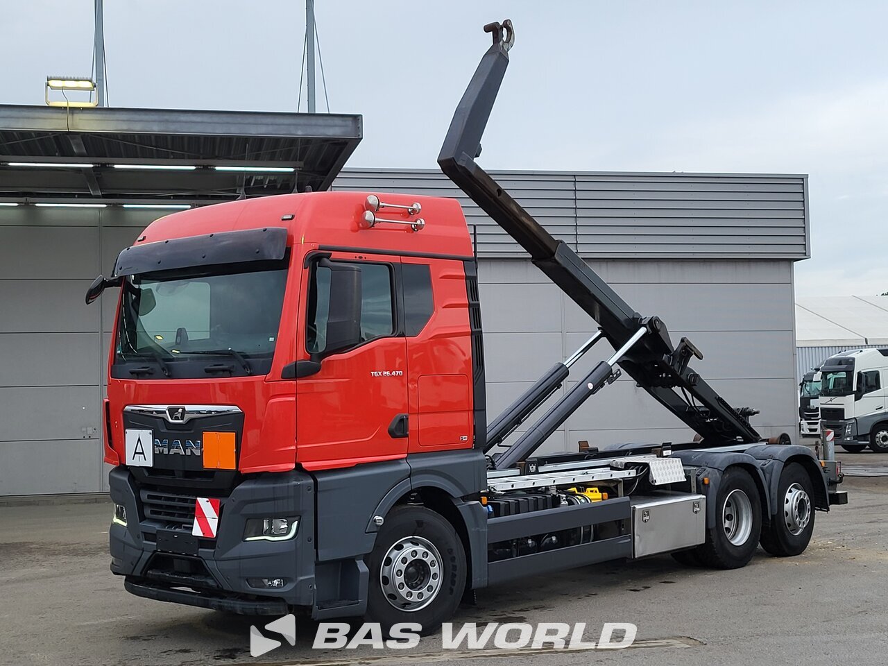 Front left : MAN TGX26.470 6X2 VDL Type:S-21-6200 camion à bras